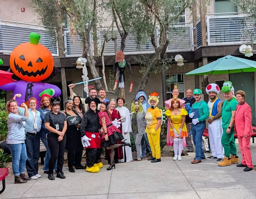 Stepping Stone staff in costume at a Halloween celebration